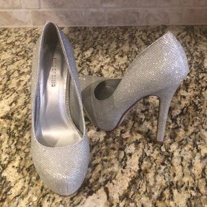 Silver high heel shoes.
